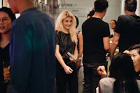 a group of people at a party in a bar