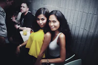 two women posing for a photo at a party