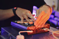 a person playing a dj mixer